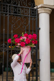 Premium pink floral arrangement in signature luxury hat box