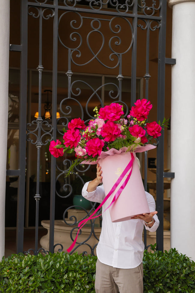 Luxury floral gift in pink hat box with fresh seasonal flowers